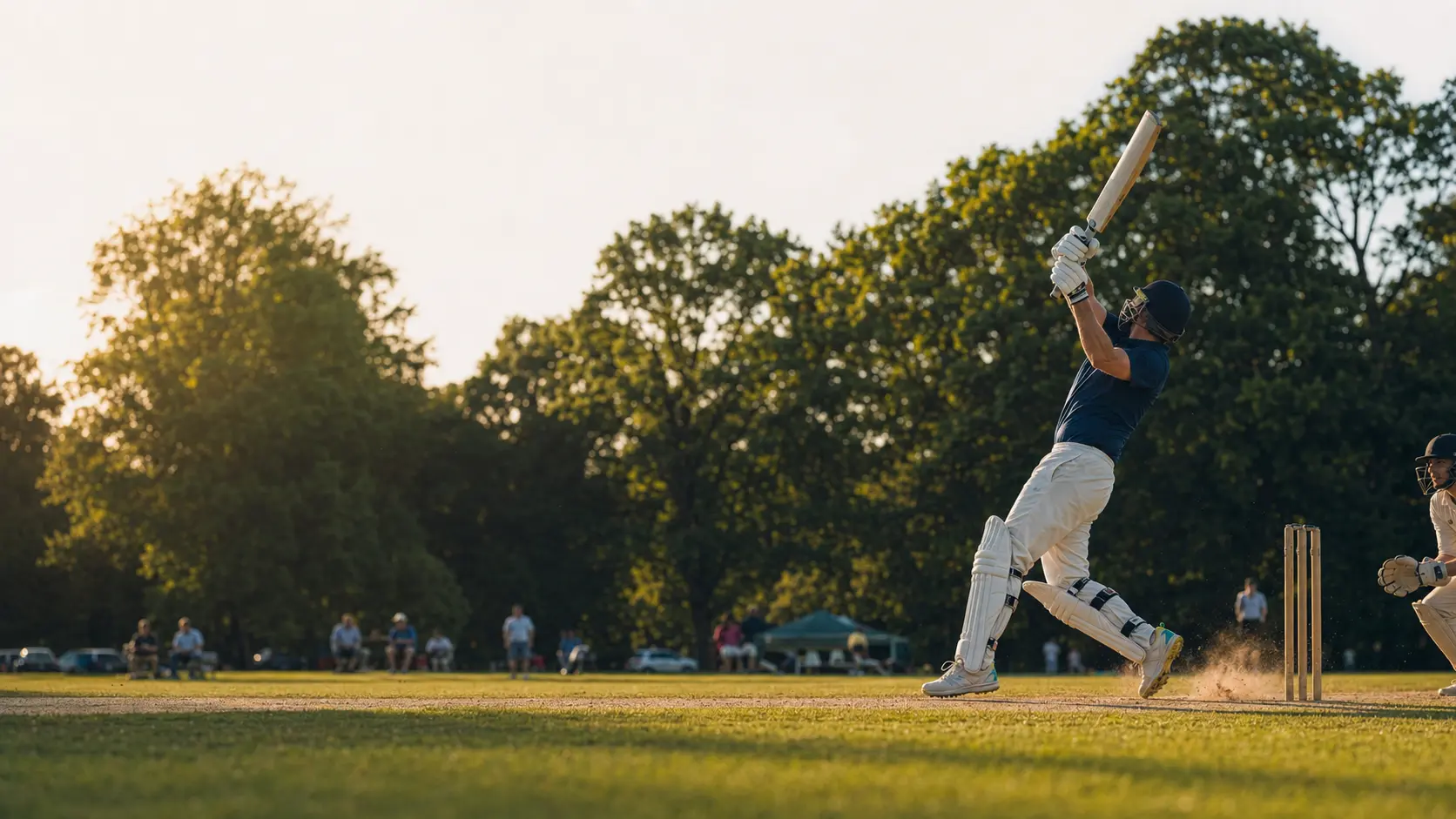 A cricket batter playing an attacking shot at a community ground
